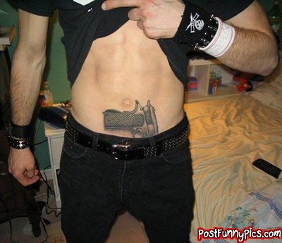 funny picture of tattoo man has that looks like he has a gun tucked into his waist