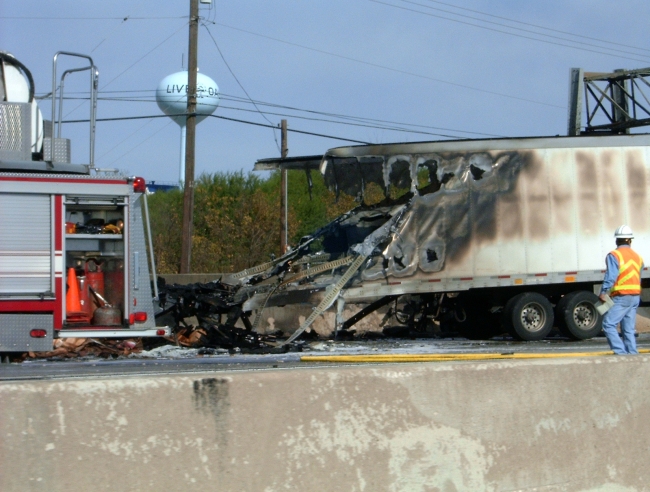Big rigs gas tanks exploded after running over a car and hitting a wall. Killed the truck driver and the other driver.