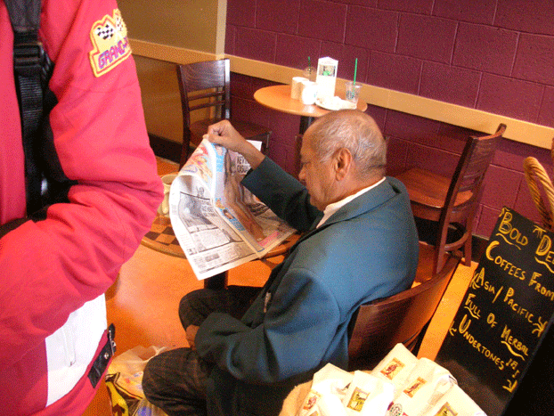 This old man seems to read a VERY interesting newspaper :-P