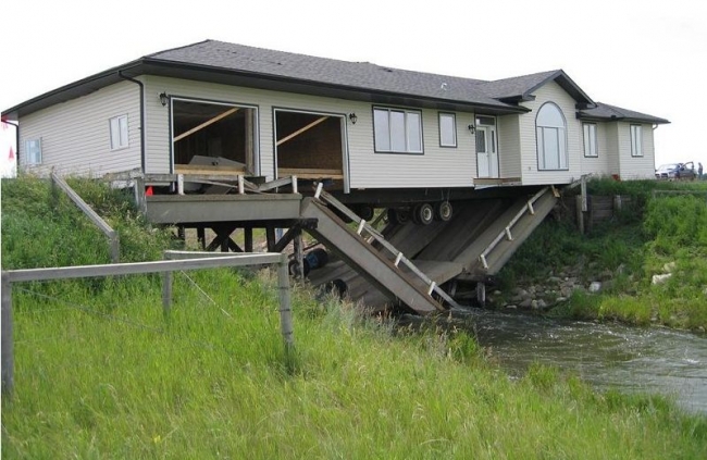 Bridge Collapses Under House