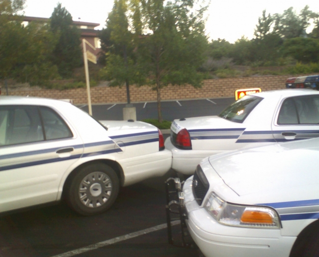LoL... I took this photo outside Taco Bell here in Grand Junction, not only did the cop hit his fellow officer - he left his car parked in the guys bumper and went in to eat!  My tax dollars at work, huh.