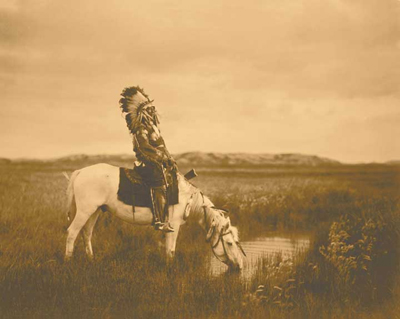 Edward S. Curtis - Red Hawk at an Oasis in the Badlands (1905)