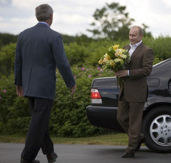 Putin courts Bush with flowers.....love is in the air