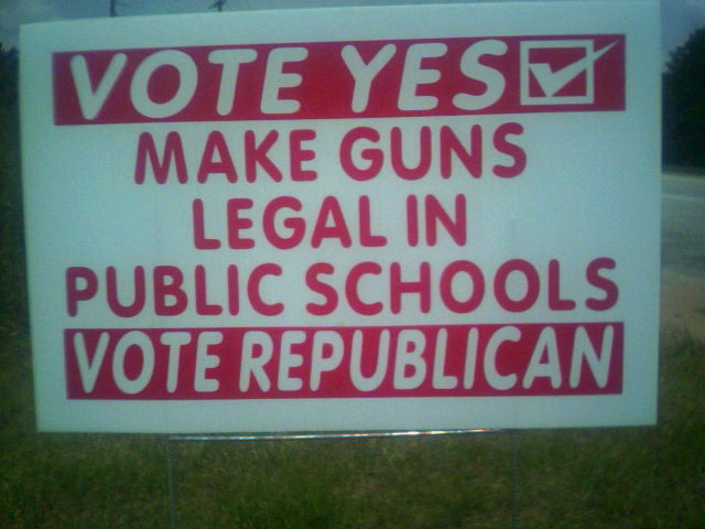 Hey kids, dont forget your lunch.. Oh! And your 9mm.I saw this while driving through South Carolina on a road trip.