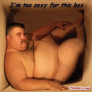 A super fat guy with huge boobs in a cardboard box.