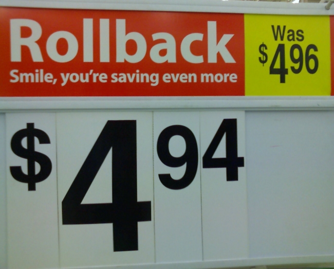 This advertisement was found near the entrance of a Wal-Mart.  You save 0.4!