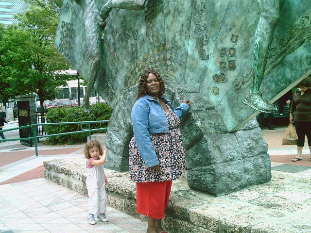 Pic that was took at Atlanta Centennial Olympic Park  . My sister is in the picture, when it is developed a little girl appears.