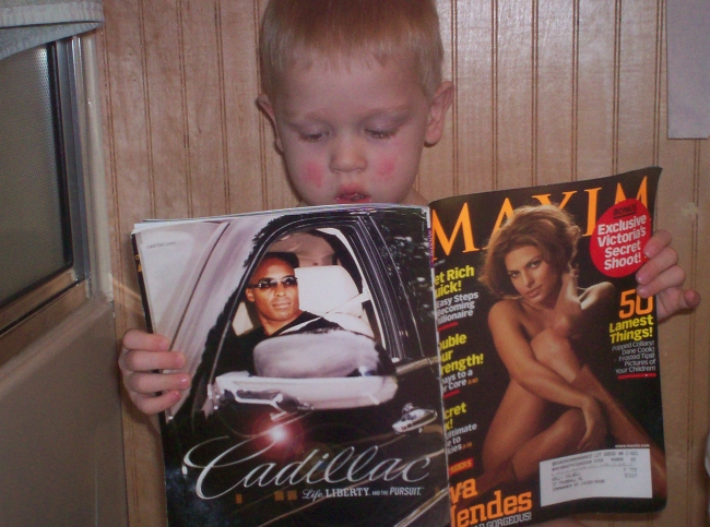This is my son who my husband snapped a shot of while actually on the  can reading Maxim.  Lets hope hes not just interested in the articles!
