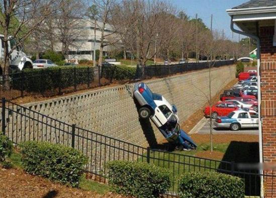 Dumbass Cop Drives Off A Drop