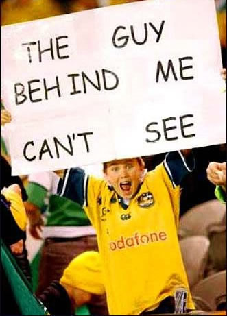 dont you hate twats with big posters at footy games