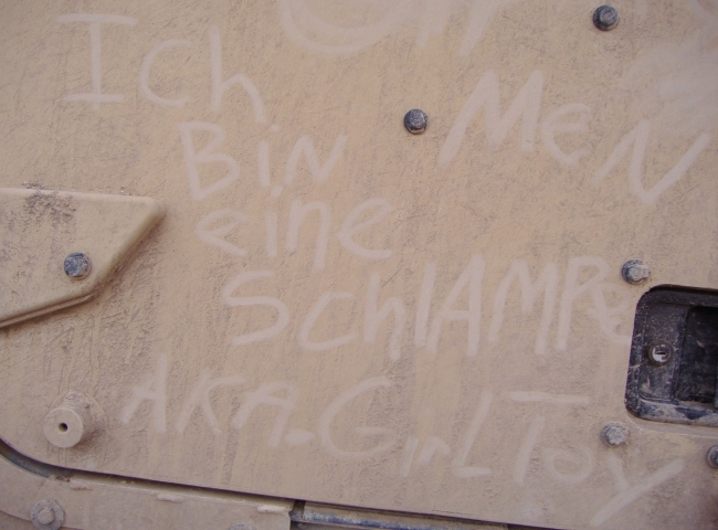 A message written in German on a truck in Iraq.
"Ich Bin eine Schlampe."
Which means: I am a slut.