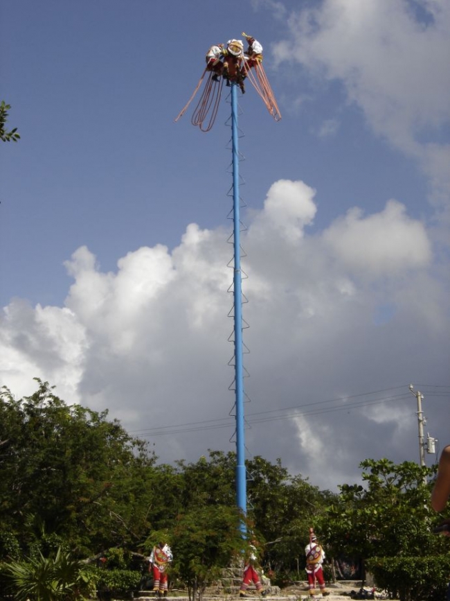 Mayans swinging from pole