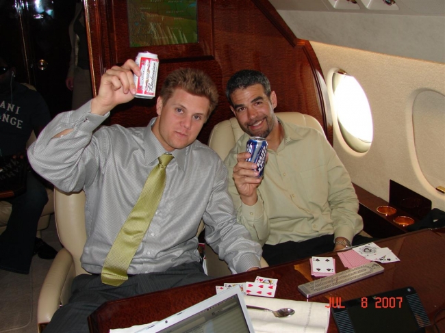 red sox players celebrating on a private jet after 2004 world series