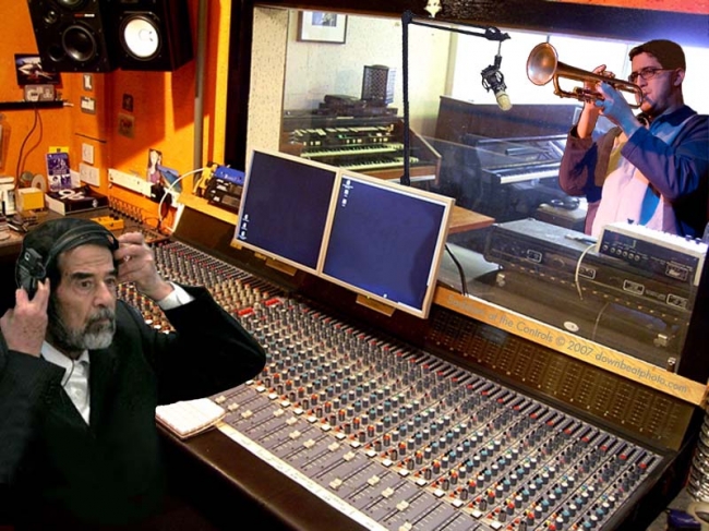 Saddam in the studio, makin hits.
