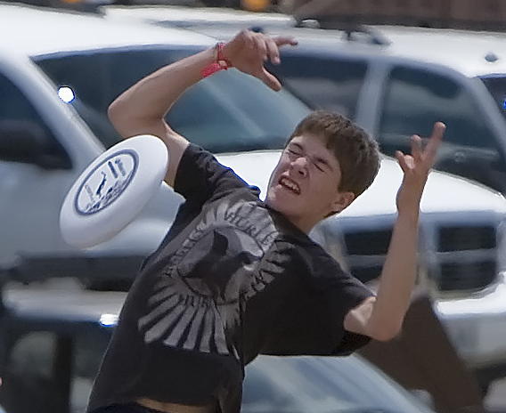 Picture of a kid failing to catch a frisbee