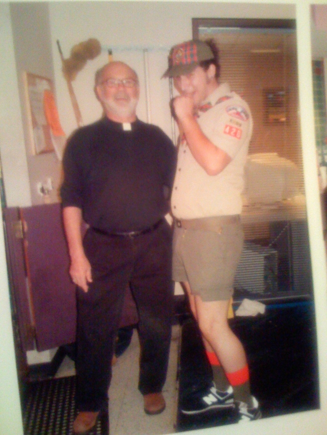 2 guys I work with dressed up for Halloween. A Priest and a little Boy Scout! ...creepy