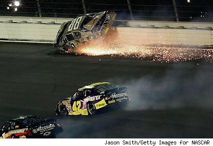 Sparks fly as the No. 88 car, driven by Brad Keselowski, hits the wall at the Camping World 300 at California Speedway on Sept 1, 2007.