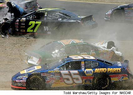 No. 55 Michael Waltrip, No. 14 Sterling Marlin and No. 27 Tom Hubert crash in the first lap during the Dodge Save Mart 350 on June 25, 2006.