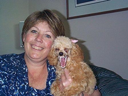 This lady is holding a rabid dog