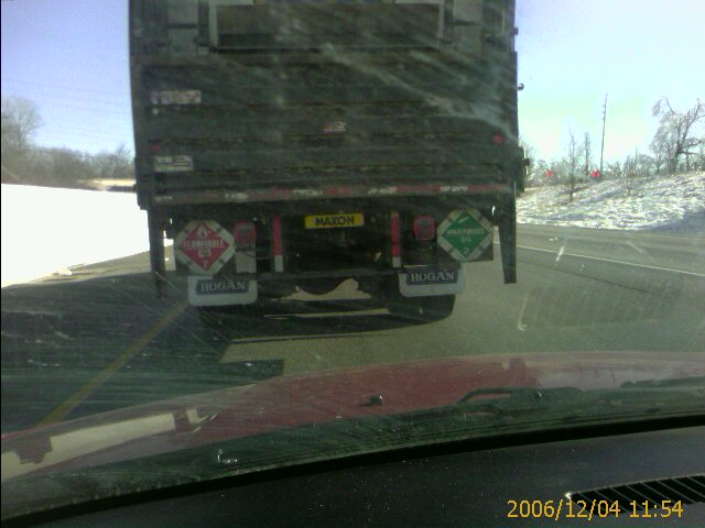 This truck doesnt know what cargo its carrying.. the red and green signs indicate there is both flammable and non-flammable gas onboard.
