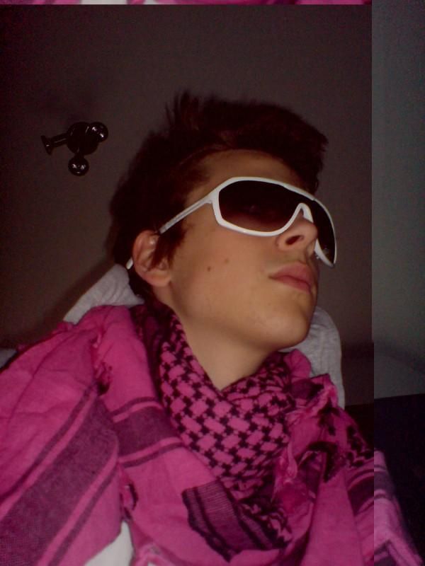 pink scarf.. white sunglasses..inside? gay