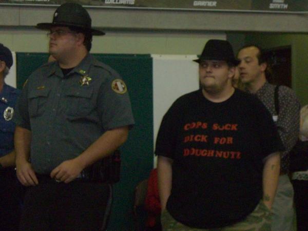 This was at our high school graduation!  This guy stood right beside this cop the hole time.