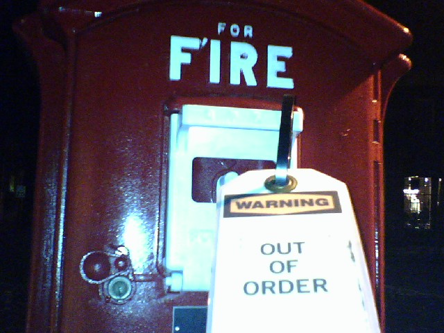 Fire emergency alarm with an out of order sign on it. anyone going to fix this? firefighters?