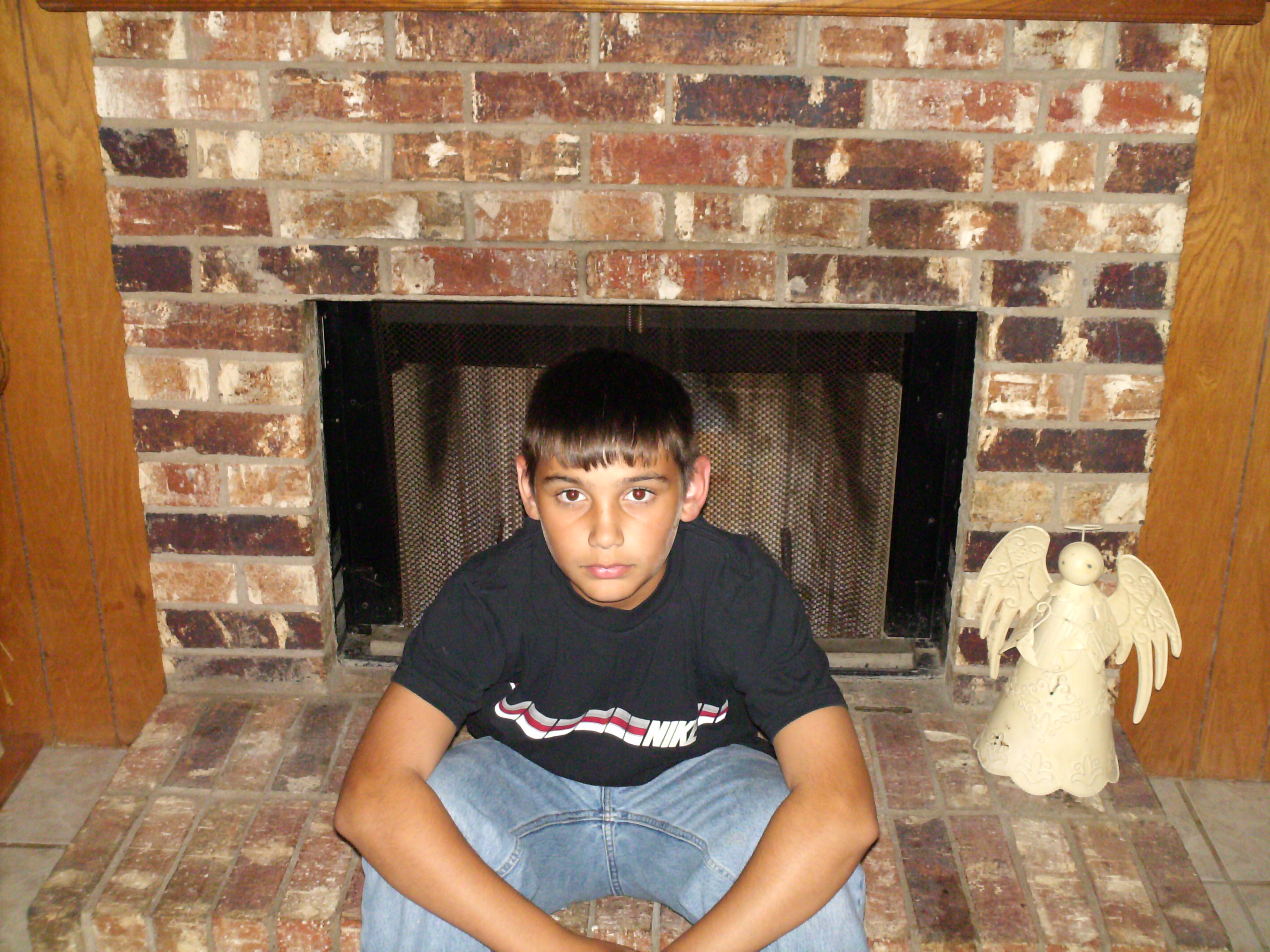 me sitting on the fireplace