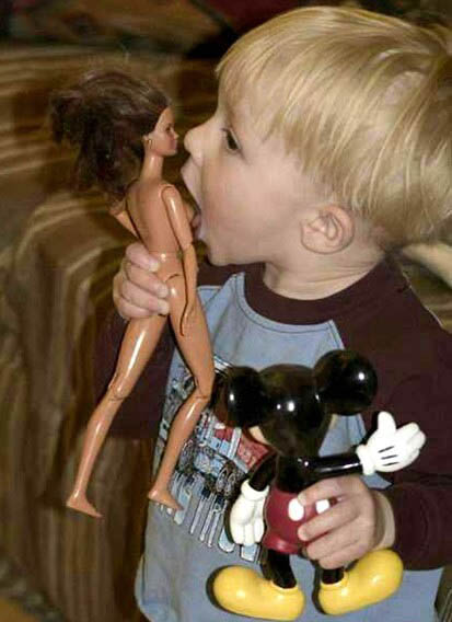Kid licking himself some Barbie boobs!