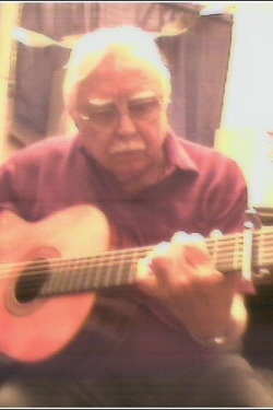tio milo playing his guitar