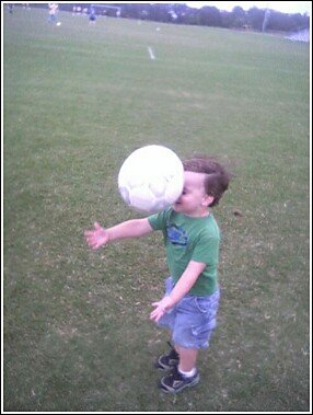 kid attempting to catch a soccer ball miscalculates the speed it