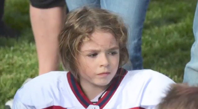 child football player looking off camera