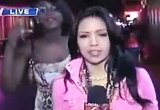 A reporter masterfully handles an interruption during a live broadcast.