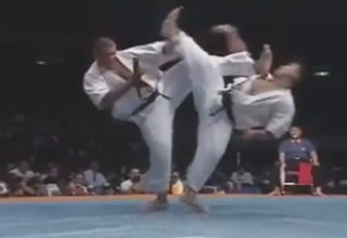 Two fighters spin-kick, one comes out on top.