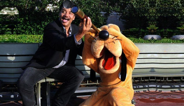 Neil deGrasse Tyson helping pluto use a telescope