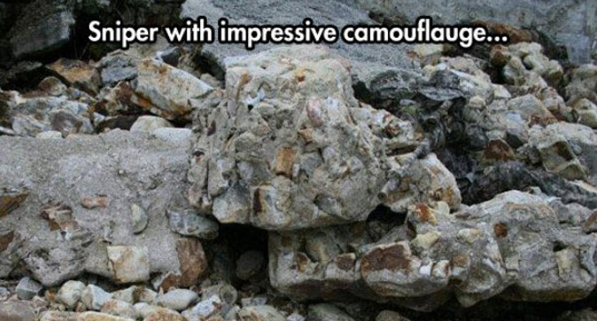 Sniper completely hidden in rocks.