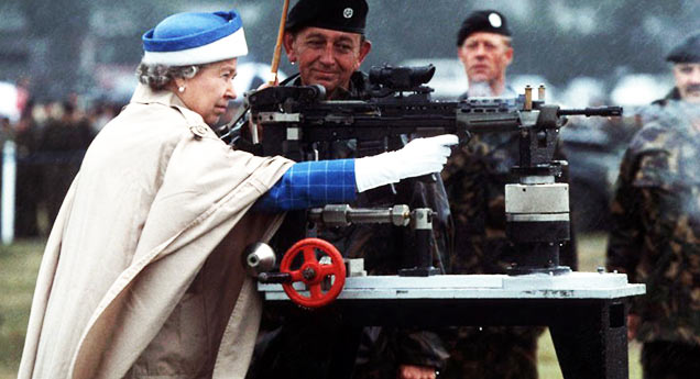 queen shooting machine gun