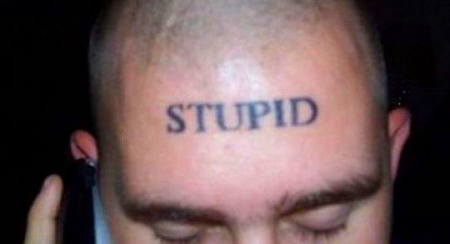 man with the word stupid tattooed across his forehead