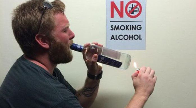 Man next to sign that says no smoking alcohol meme - Smoking Alcohol