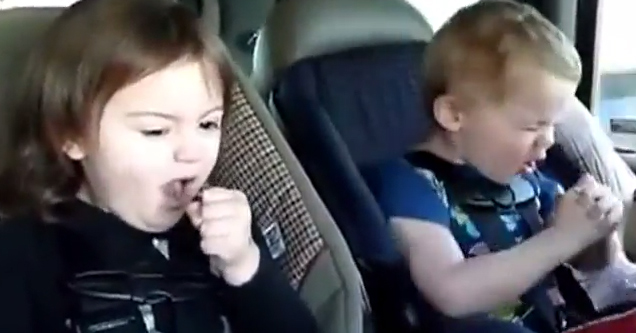 kids rocking out in car