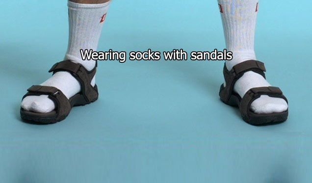 person's legs in socks and sandals