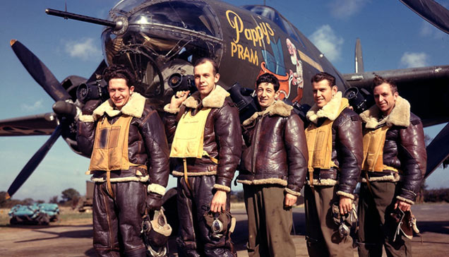 photographers pose with airplane