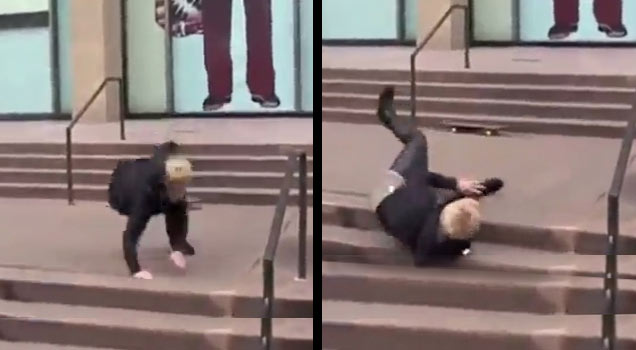 Justin Bieber falling down steps on a skateboard.