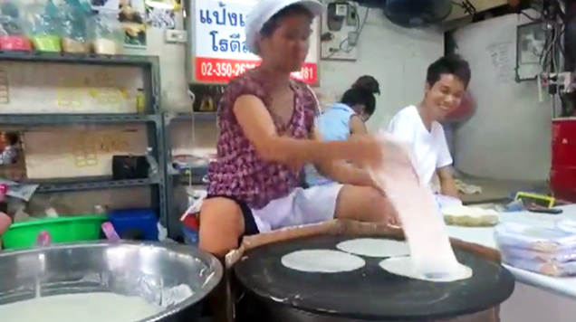 woman making rice paper