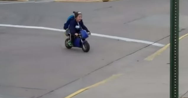 kindergartner rides motorcycle to school