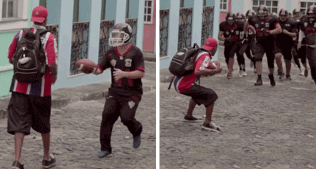 football player hands off ball and team appears