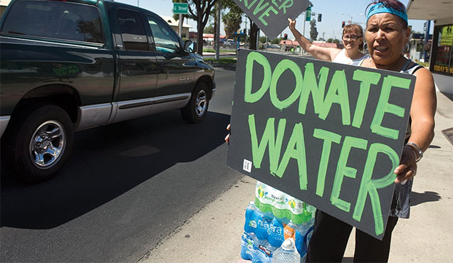 woman pleads for people to donate water