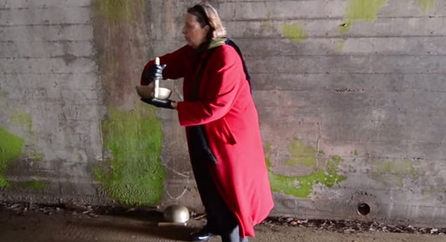 old woman sings in creepy tunnel