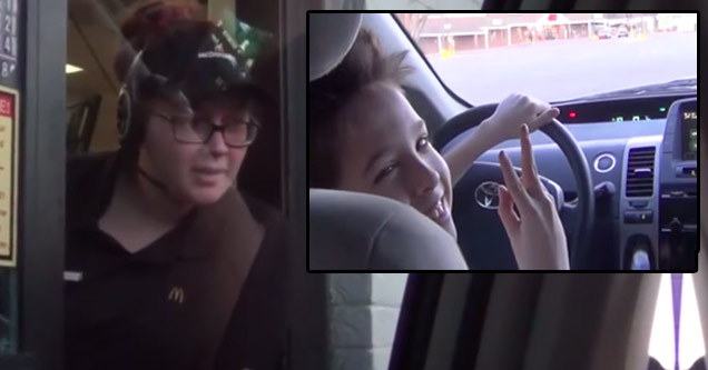 young kid drives car through drive thru