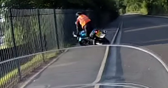 motorcycle rider crashes into fence